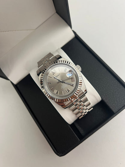 Datejust (Grey Roman) Seiko NH35 automatic mod watch. A grey dial watch with a silver fluted bezel and a metal jubilee bracelet inside an open watch box.