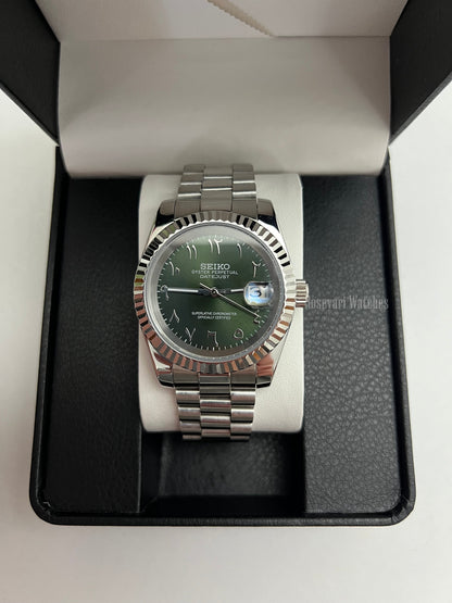 Datejust (Arabic Olive) Seiko NH35 automatic mod watch. A full watch with a green dial and silver fluted bezel on a silver jubilee bracelet inside a box.